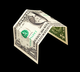 simple house from one dollar bank note isolated on black
