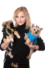 Portrait of smiling pretty blonde with two dogs. Isolated