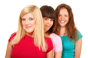 Three women brunette, blonde and redhead in a row