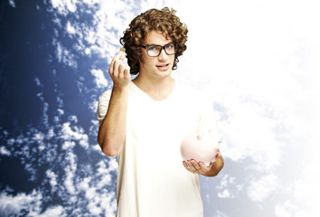 Naklejka premium man wiht piggy bank