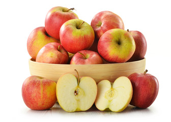 Composition with apples in wooden dish isolated on white