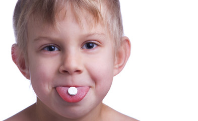 Girl with pill on tongue