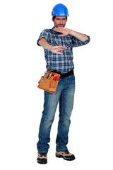 A manual worker protection his eyes.