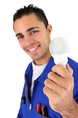 Electrician holding a light bulb