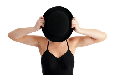 Female with bowler hat hiding face
