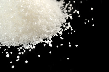 Obraz na płótnie Canvas Pile of Sugar Close-Up on Black Background