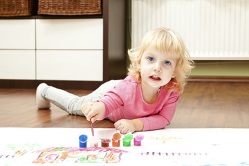 blond little girl painting