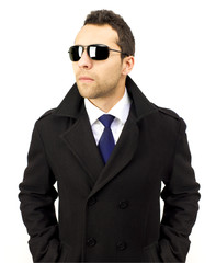 Portrait of a serious standing man with sunglasses