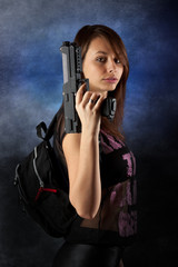 Fototapeta na wymiar freestyle woman posing with guns