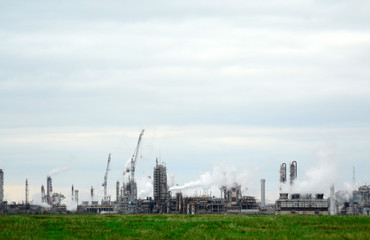 Fototapeta na wymiar Chemical plant with smoking pipes