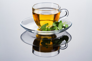 Tea cup with fresh mint leaves