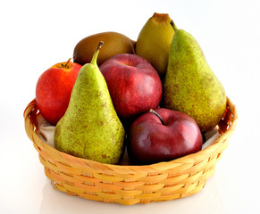 apples, kiwi, pears and an italian peach in wicker basket