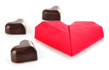 heart of chocolate and origami isolated on white background