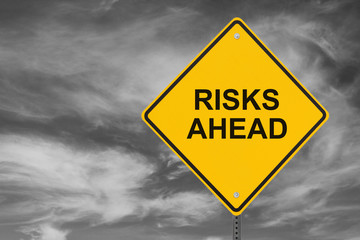 "Risks Ahead" Sign on Stormy Sky Background