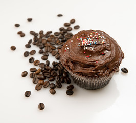 Chocolate cupcake and coffee beans