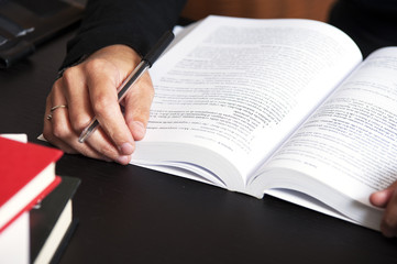 Female reading a book closeup