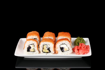 Tasty rolls served on white plate isolated on black - Powered by Adobe