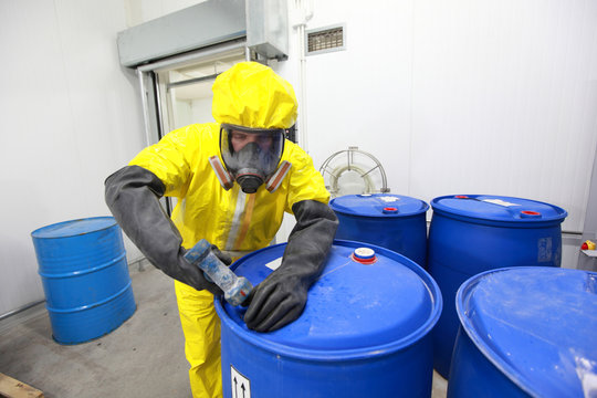 Professional in uniform dealing with chemicals