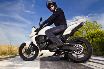 Obraz premium man with a motorcycle