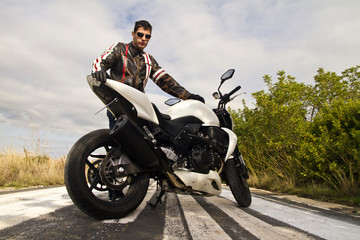Obraz premium man with a motorcycle