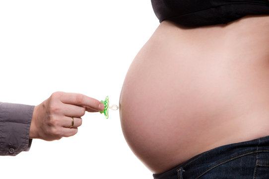 Pregnant woman belly with dummy isolated