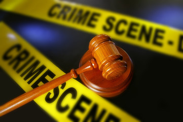 legal gavel and police crime scene tape