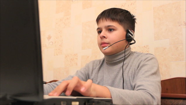 boy playing a computer game