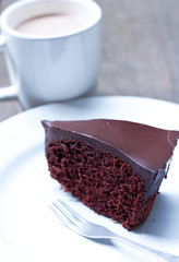 Chocolate cake with cup of cocoa