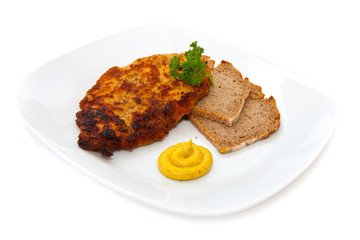 Schnitzel mit Brot, Senf und Petersilie