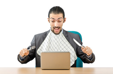 Man eating his laptop - stupid concept