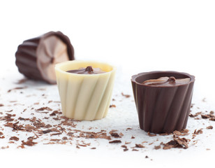 Chocolate baskets and chips on a white background.