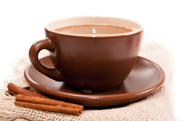 Ceramic cup of coffee with cinnamon