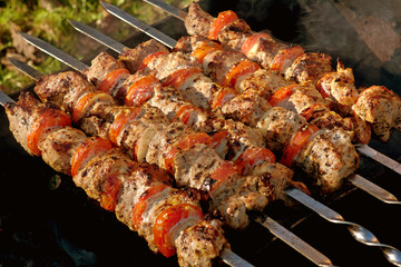 Shish kebab with vegetables on metal skewers