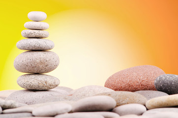 Pebbles stack against gradient background