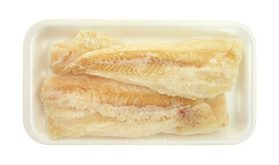 Frozen pollock pieces on white tray