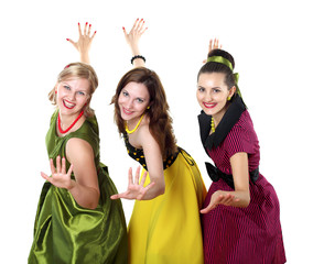 three young woman in bright colour dresses