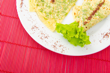Pancake with herbs in the plate