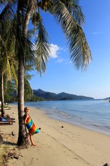 Woman enjoy a moment on tropical beach