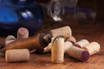 Old corkscrew and corks