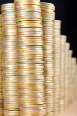 Golden coins in high stacks