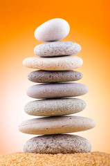 Balanced pebbles with colour background