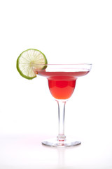 Lime garnish and red drink.