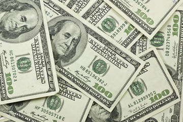 pile of 100 dollar bills