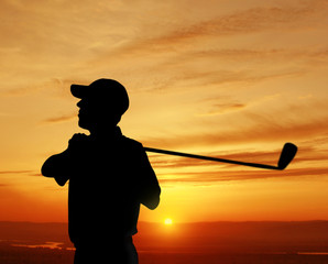 male golfer sunset