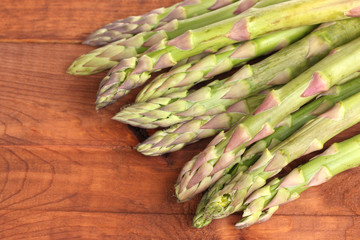 delicious asparagus on wooden background