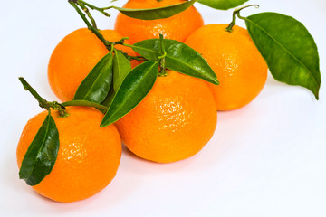 a few fresh sweet mandarin with green leaves