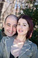 Fototapeta premium Happy Couple Husband Hugging His Wife