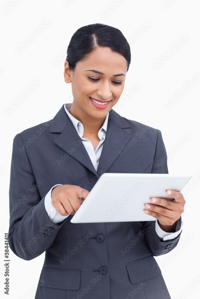 Poster close up of smiling saleswoman using her tablet computer