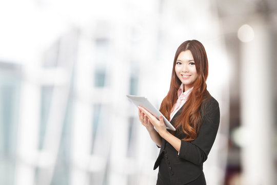 Business woman smile using tablet pc