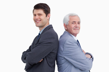 Close up of businessman and his mentor standing back to back